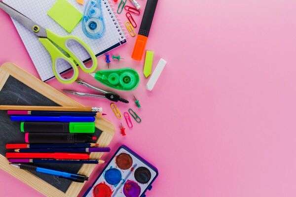 A calm creative desk with paper, stationery, and simple handmade materials